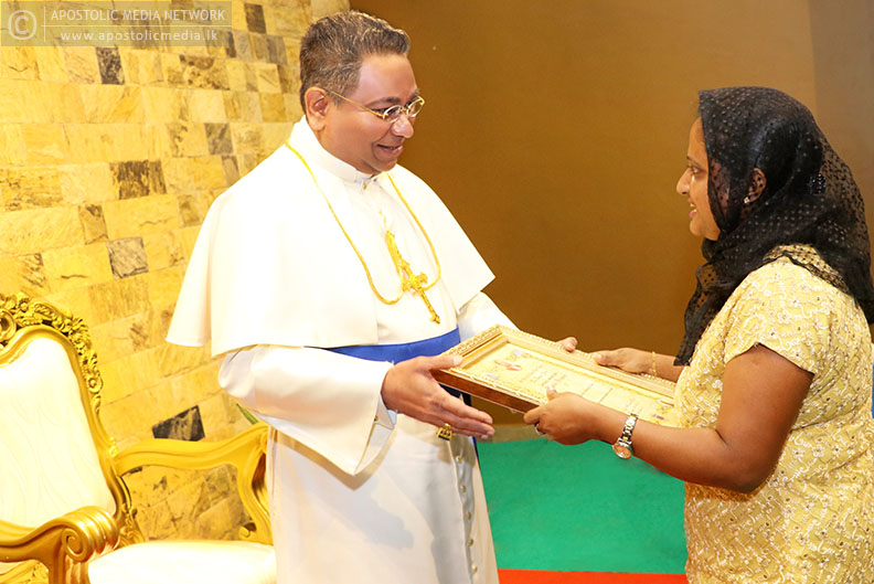 His Holiness The Apostle presents the Apostolic Blessing Certificate to Miss Manoji Dias